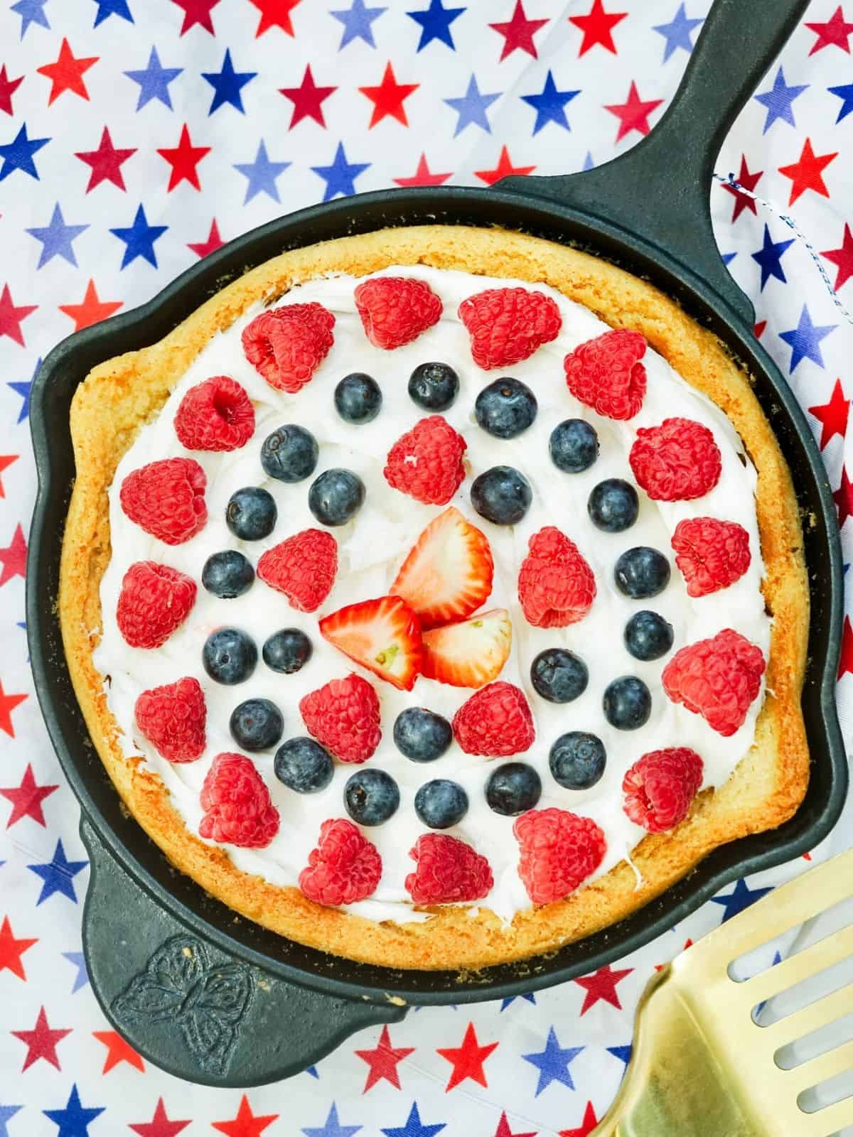 Patriotic cookie cake baked in cast iron skillet.