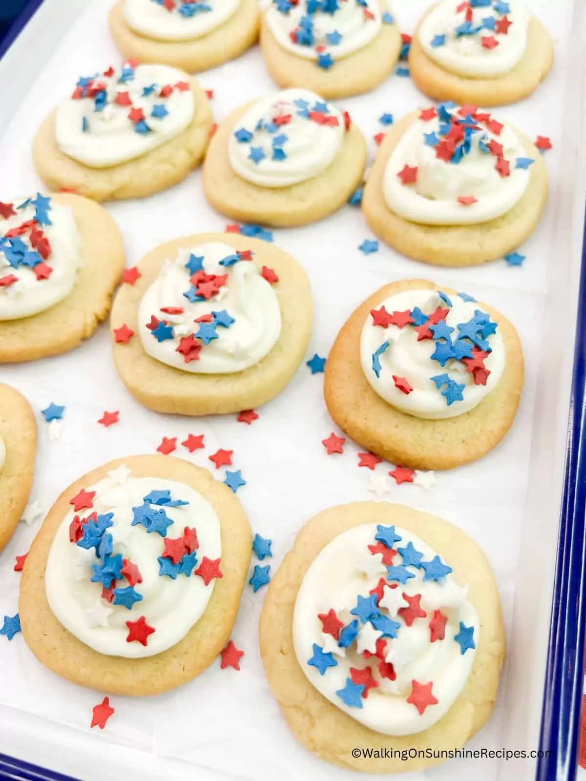 slice and bake cookies decorated for patriotic holidays on white and blue tray.