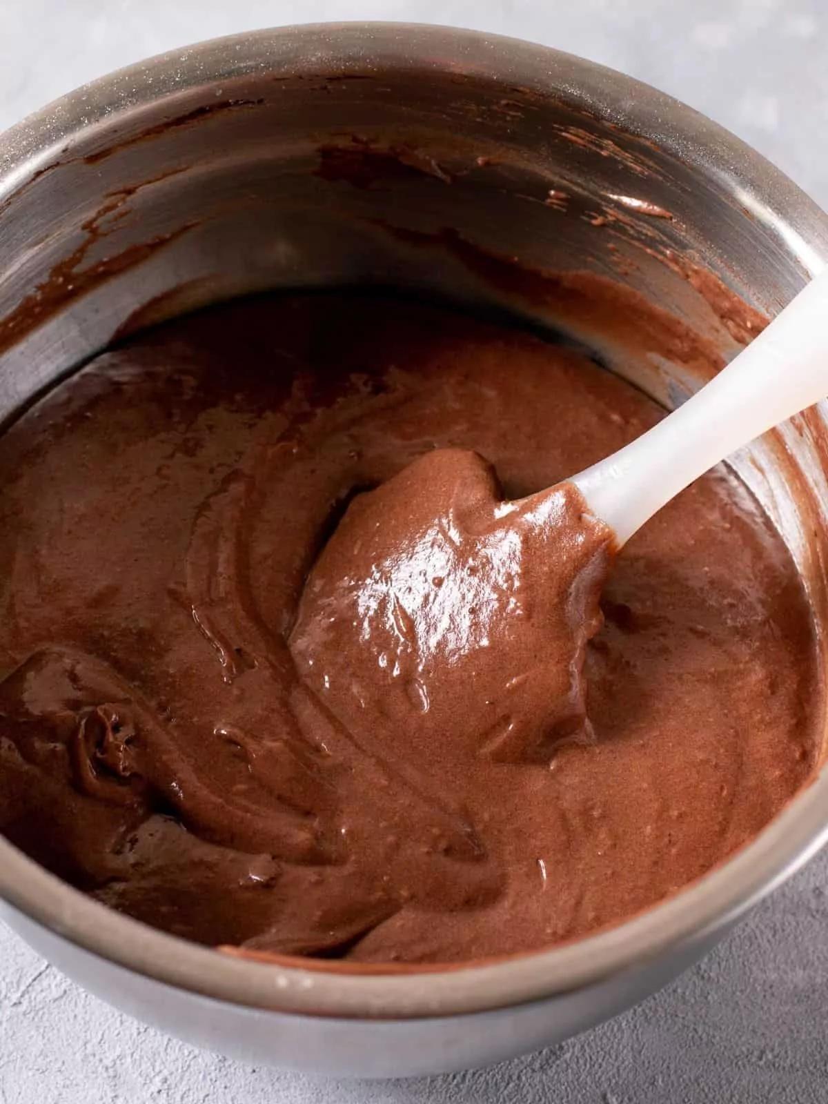 brownie batter and cake batter combined in mixing bowl.