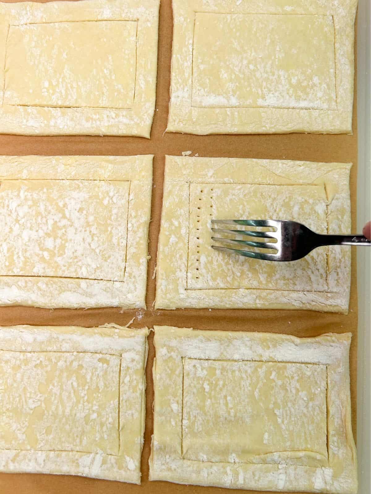 prick the puff pastry surface with a fork.