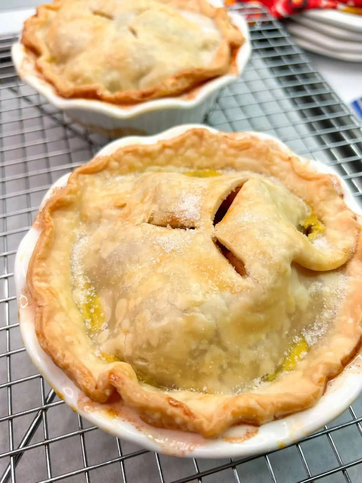Baked individual apple pies.
