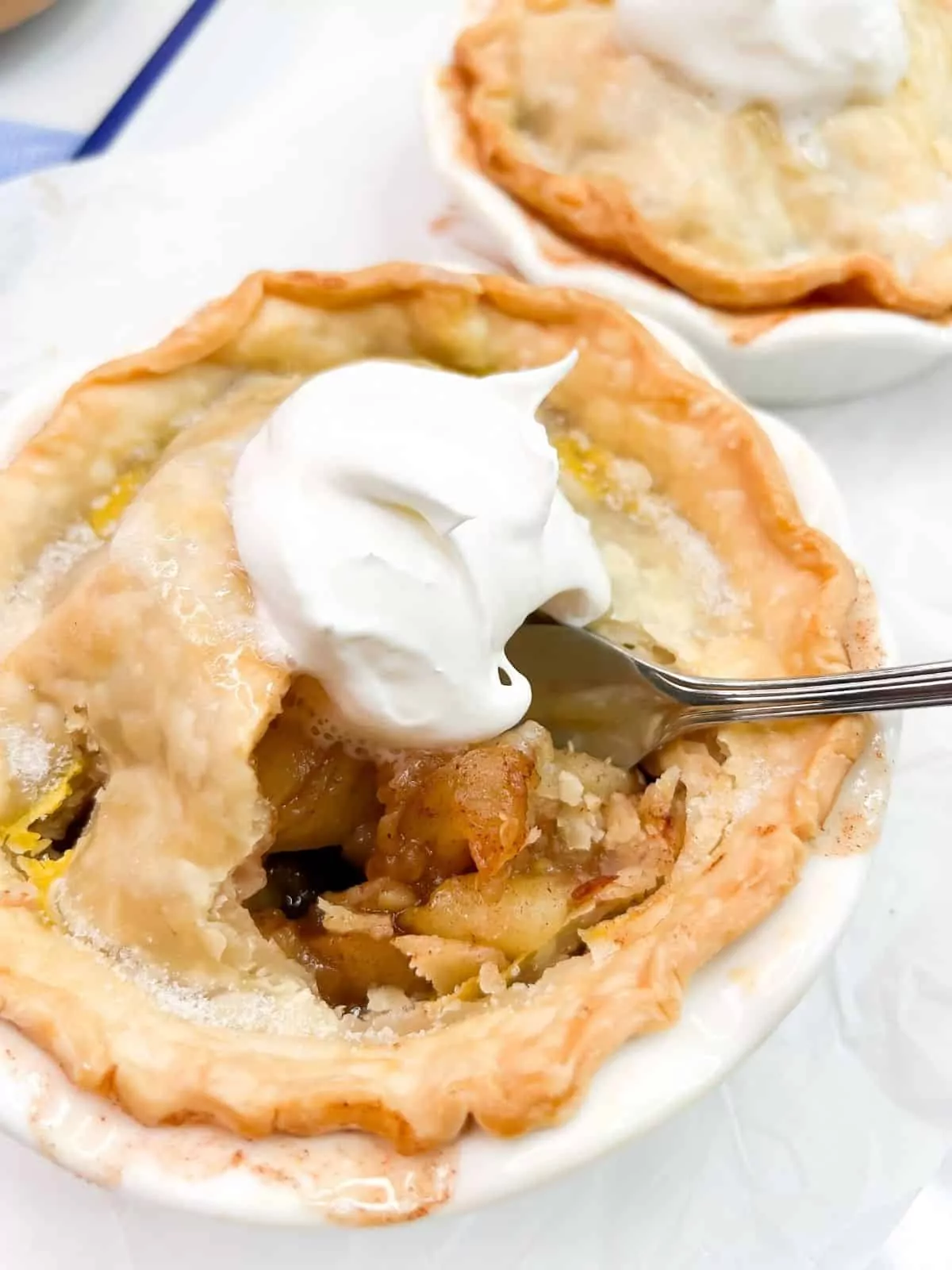individual apple pie with fork.