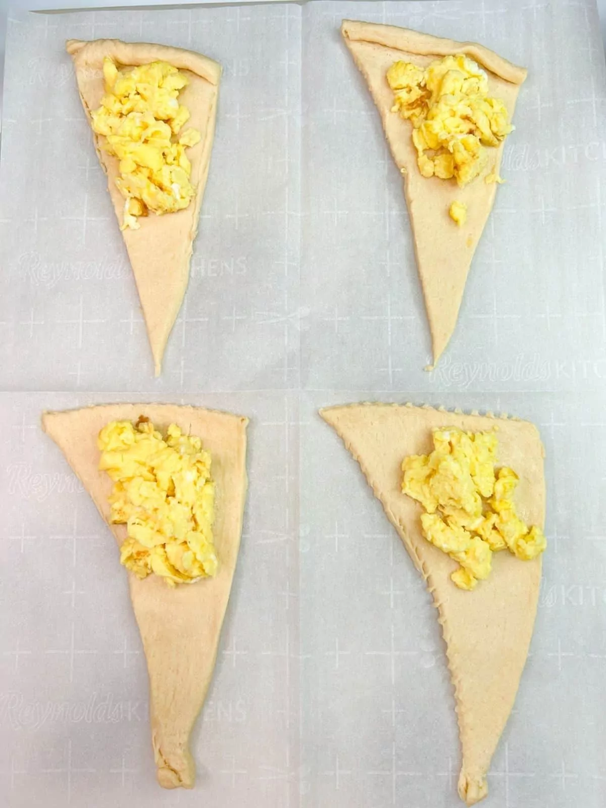crescent roll triangles with scrambled eggs.