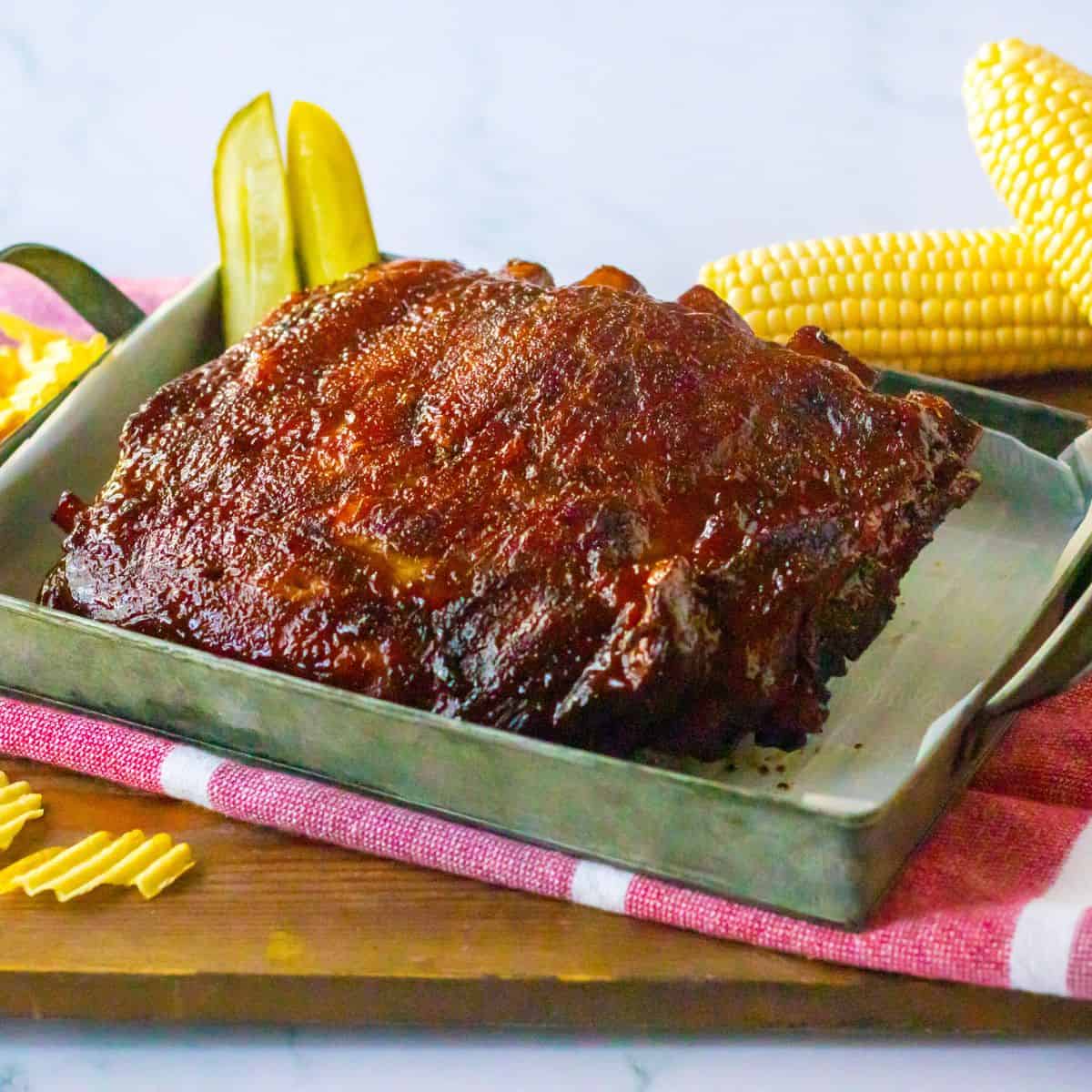featured size barbecue and crock pot ribs on serving tray.
