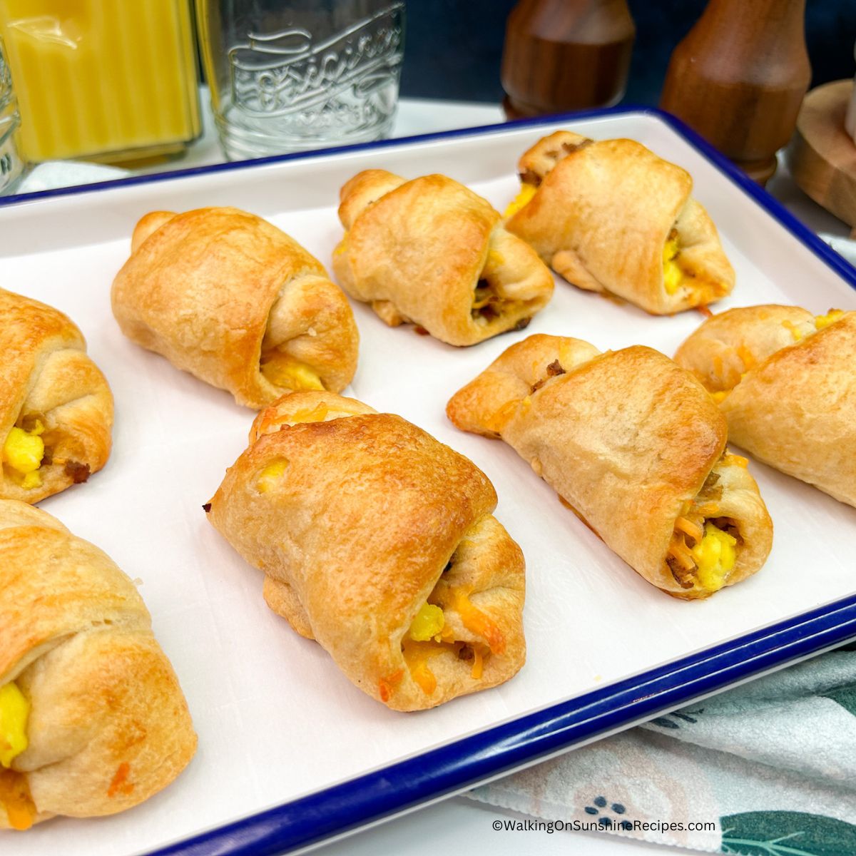 Breakfast Crescent Rolls on a blue rimmed baking sheet