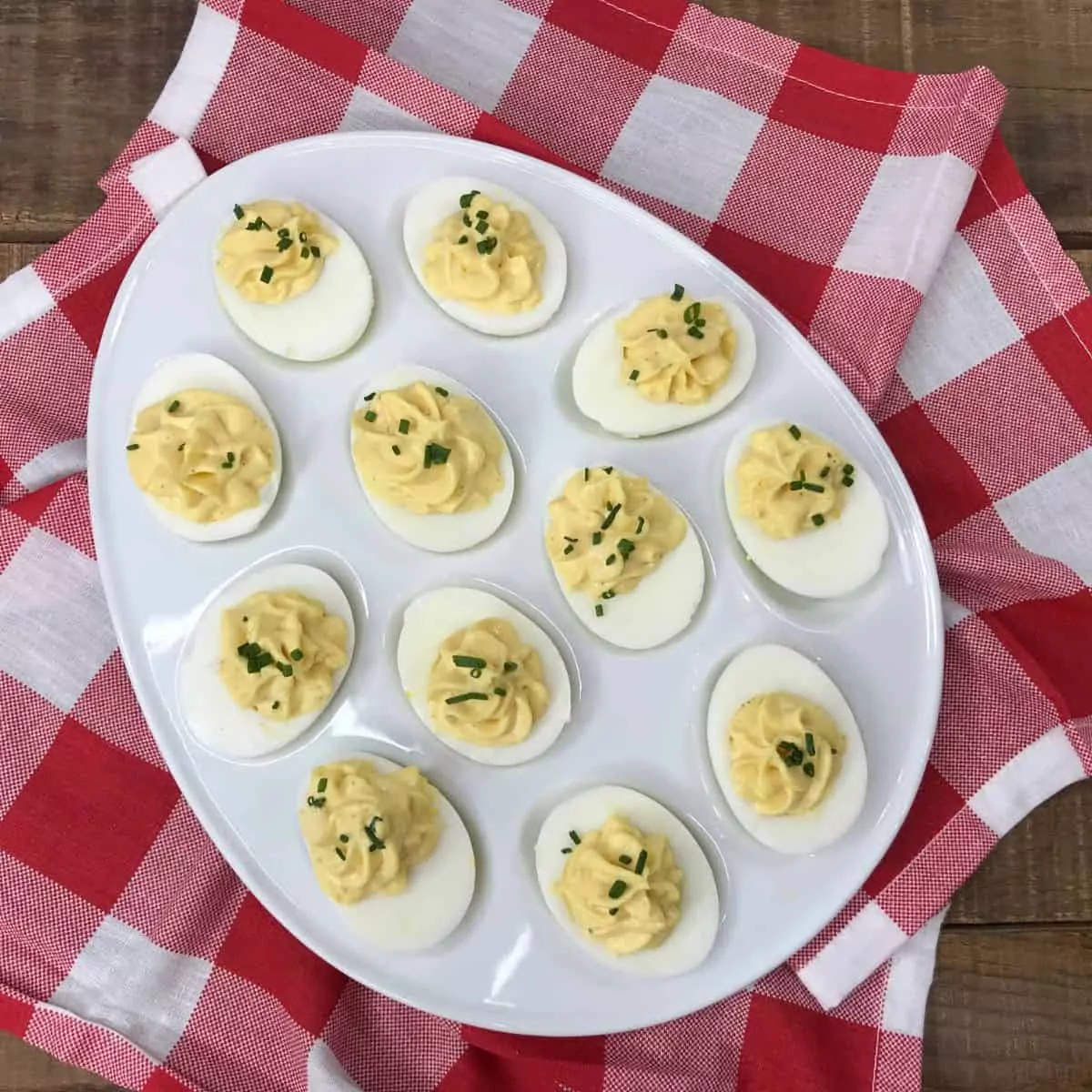 classic eviled eggs on white platter.