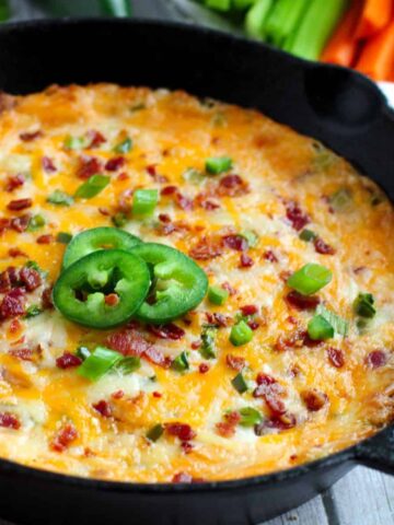 Jalapeno Cheese Dip baked in cast iron skillet.