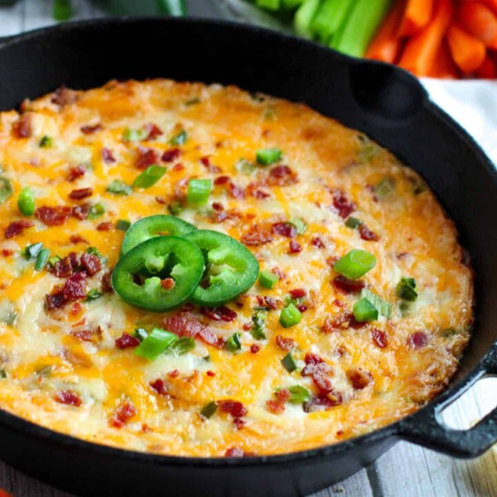 Jalapeno Cheese Dip baked in cast iron skillet.