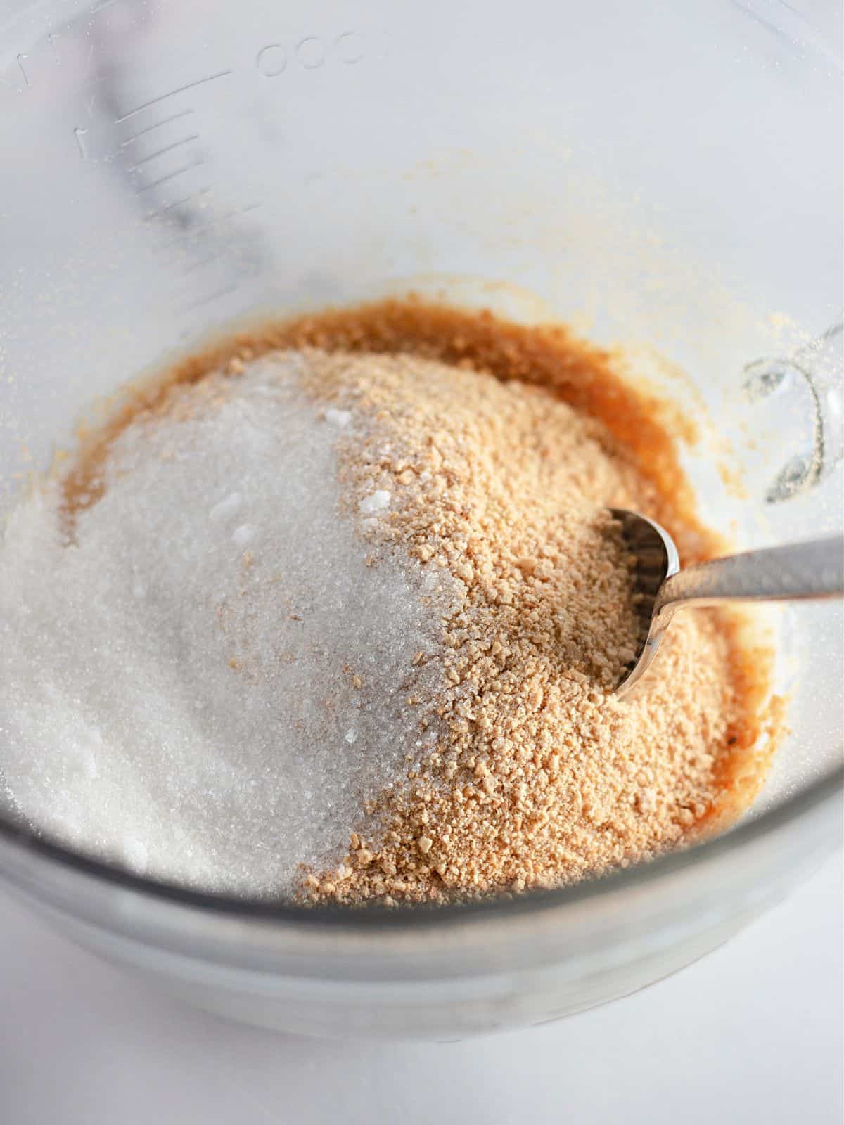 making graham cracker crumb mixture in bowl.