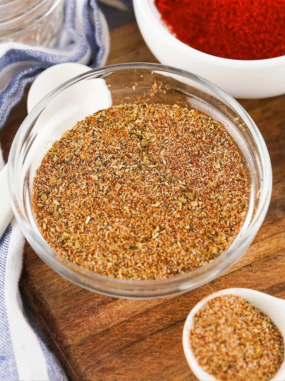 Clear glass bowl with taco seasoning mix.