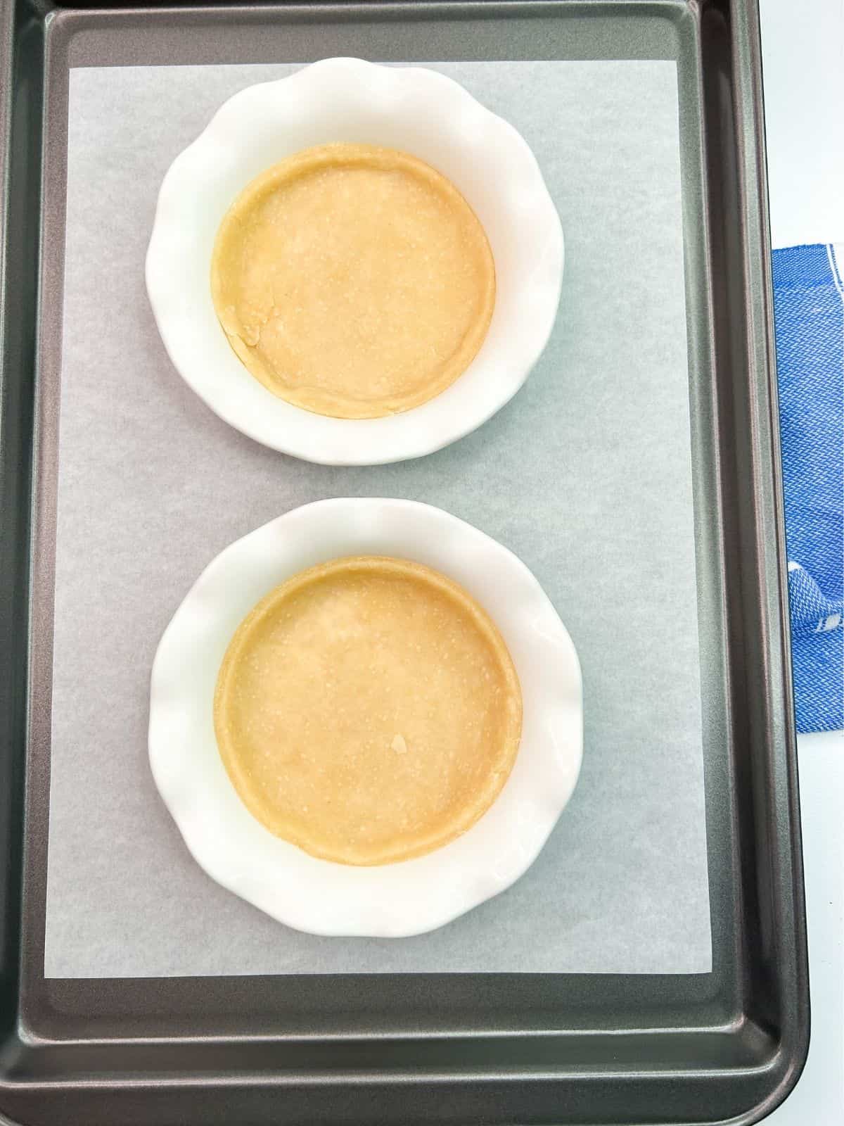 2 pie dough crusts pressed in pie plates.
