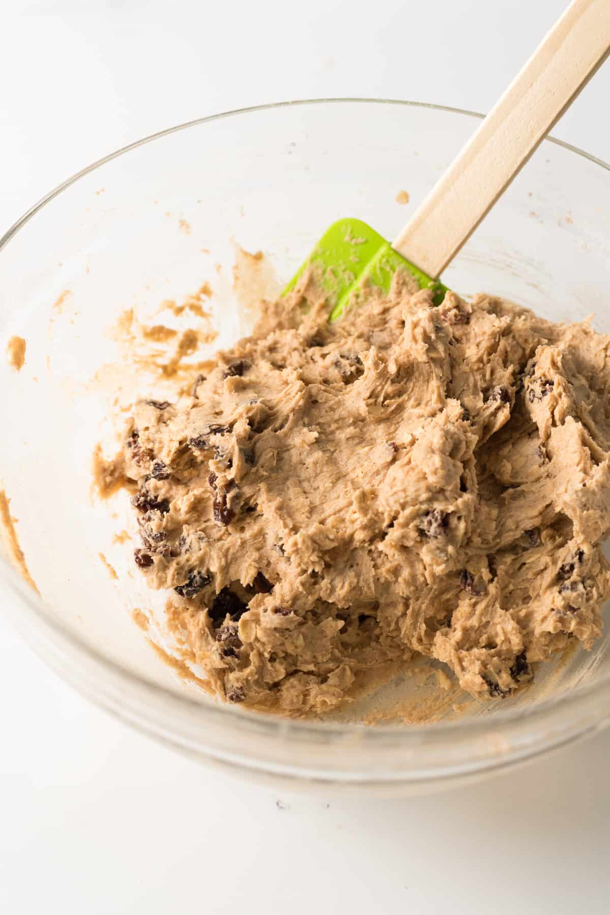 oatmeal cookie batter made with Bisquick baking mix in bowl with wooden spoon.