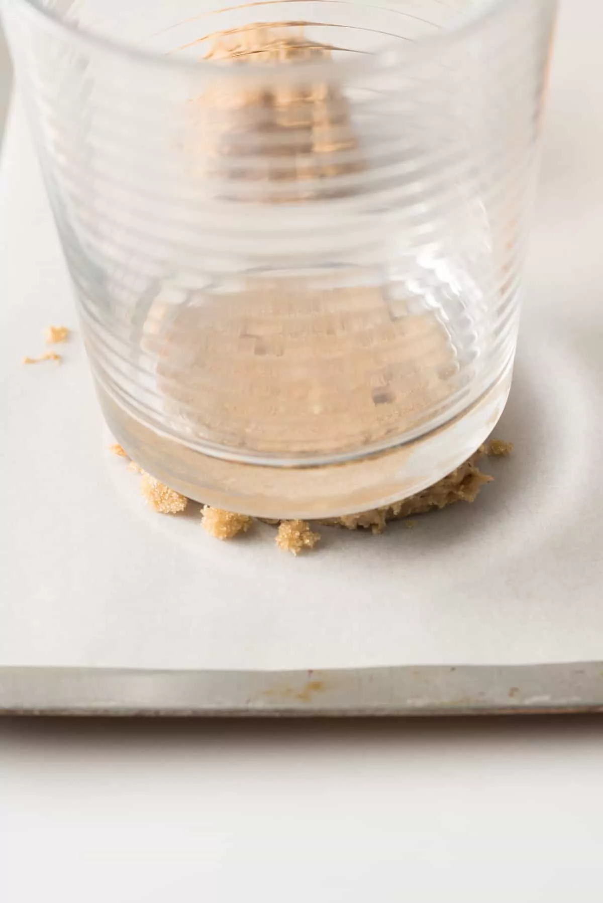 Use a juice glass to flatten out oatmeal cookies.