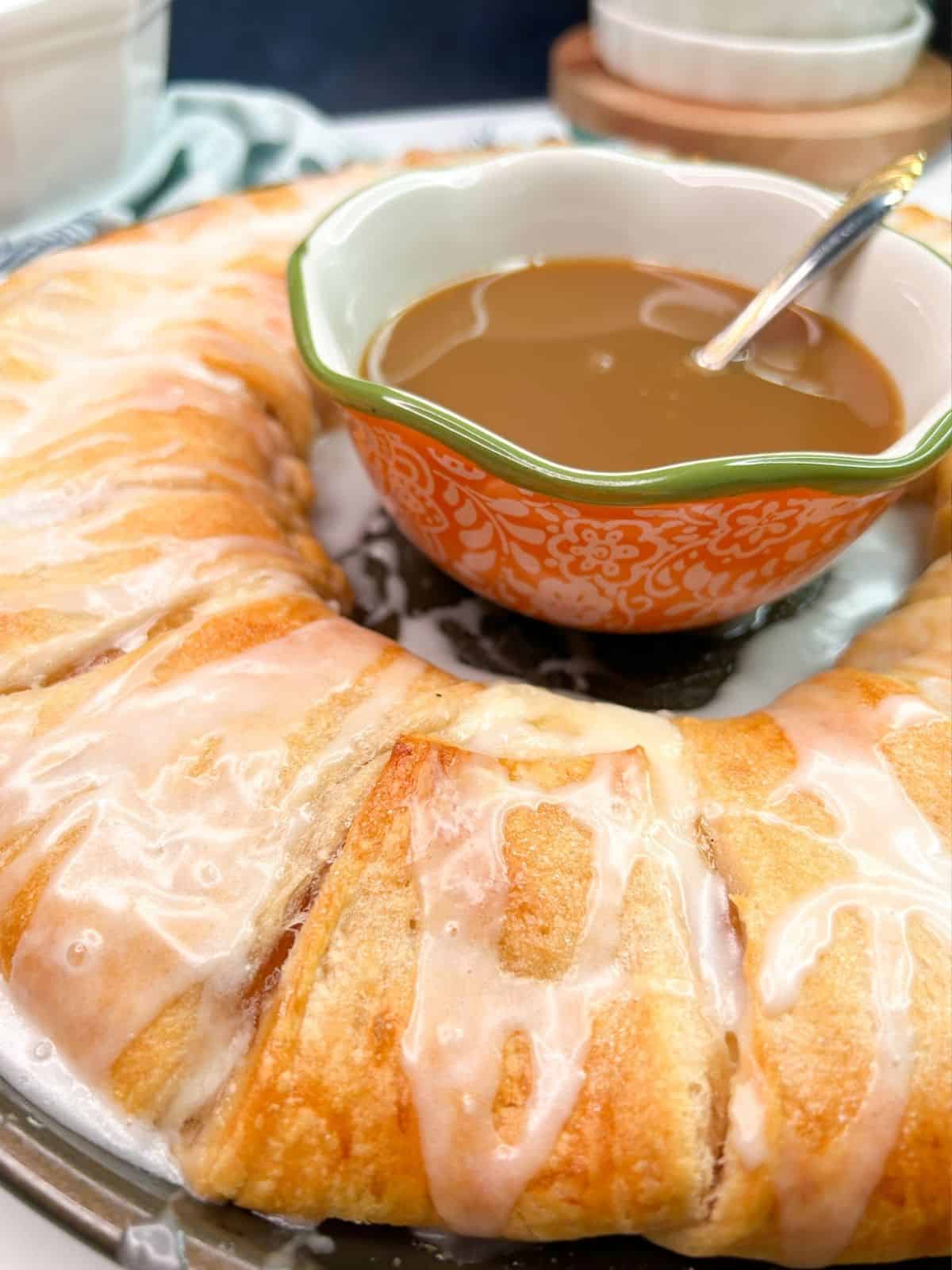 Baked crescent roll ring Danish with powdered sugar glaze.