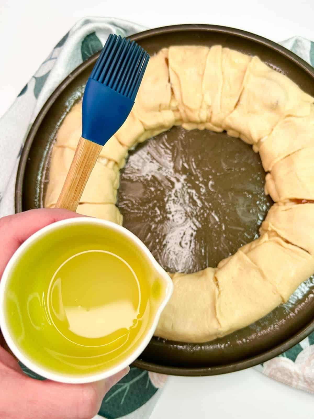 brush crescent roll ring with egg whites.