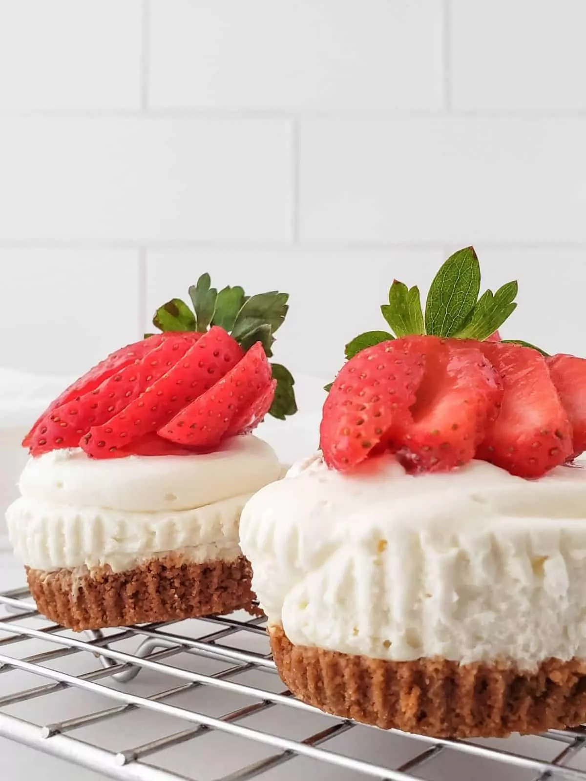 No bake cheesecake cupcakes with strawberries.