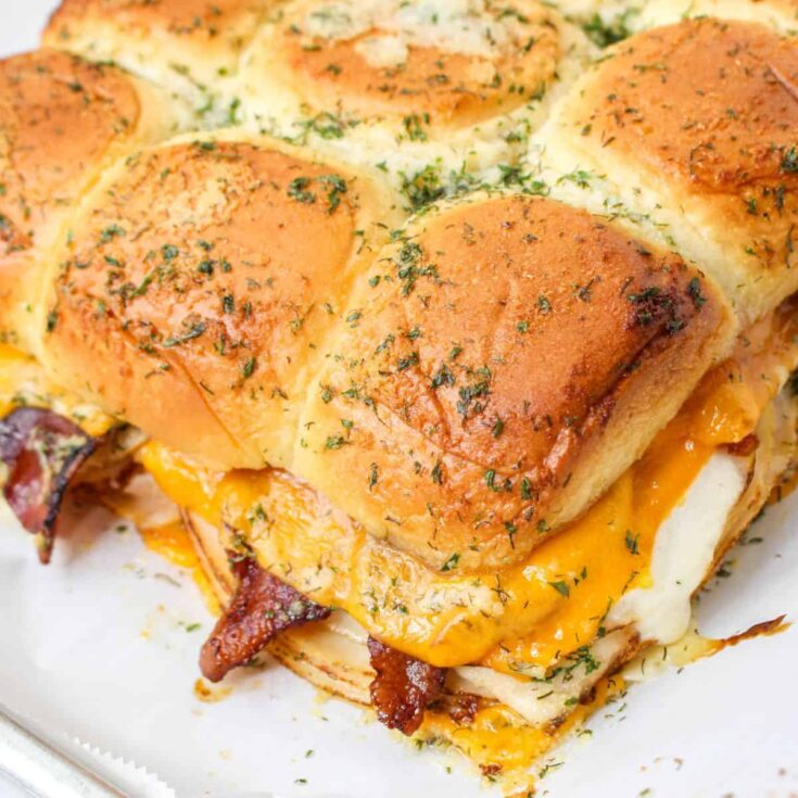 chicken slider sandwiches with bacon and cheese.
