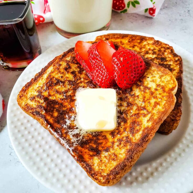 Featured French Toast on white plate.