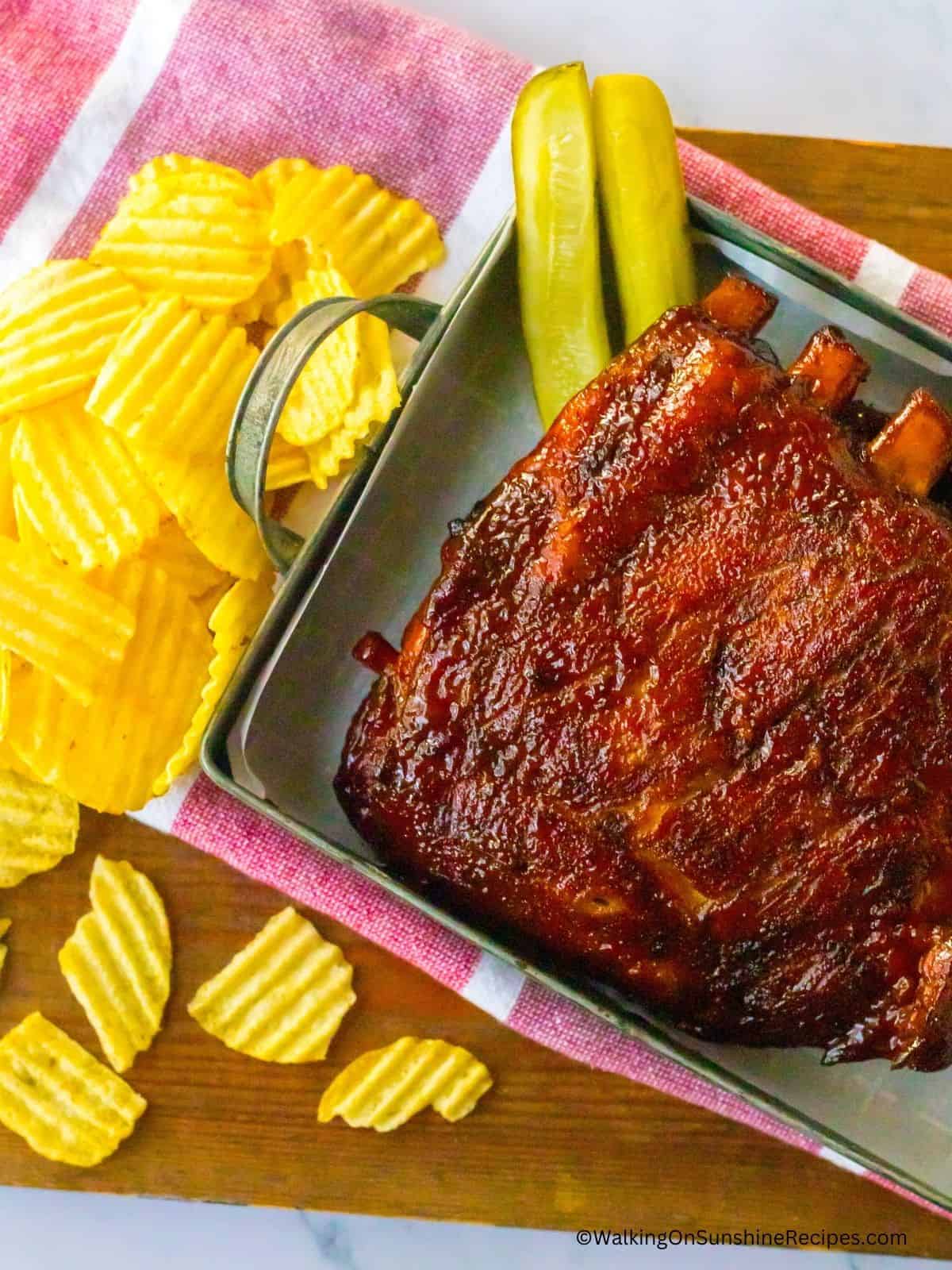 St. Louis ribs serving tray with potato chips.