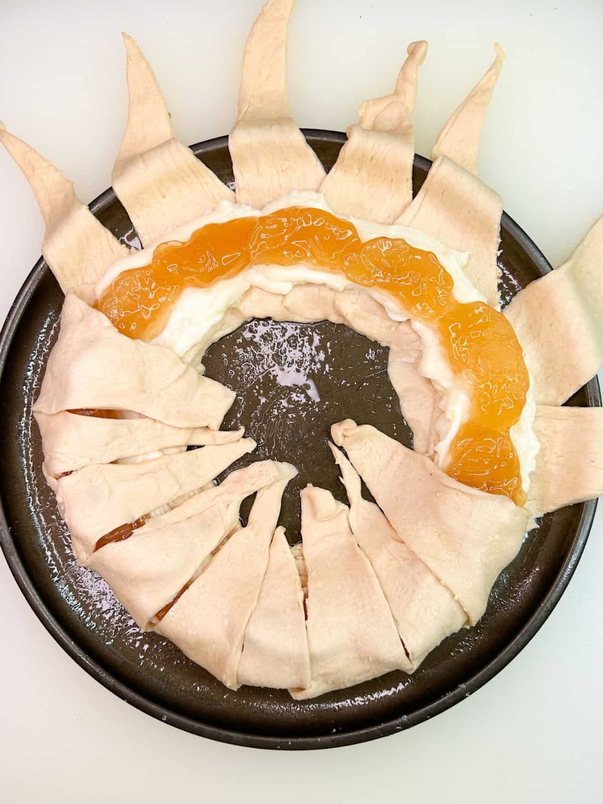 Fold crescent rolls over cream cheese apple ie filling.