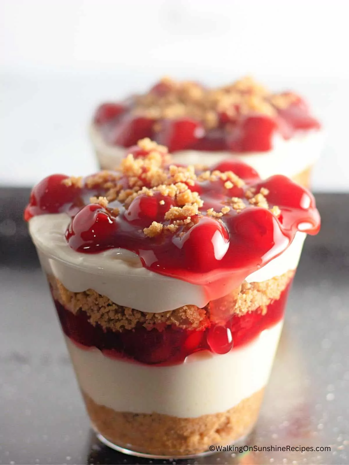 closeup of cherry pie cheesecake pudding cups.