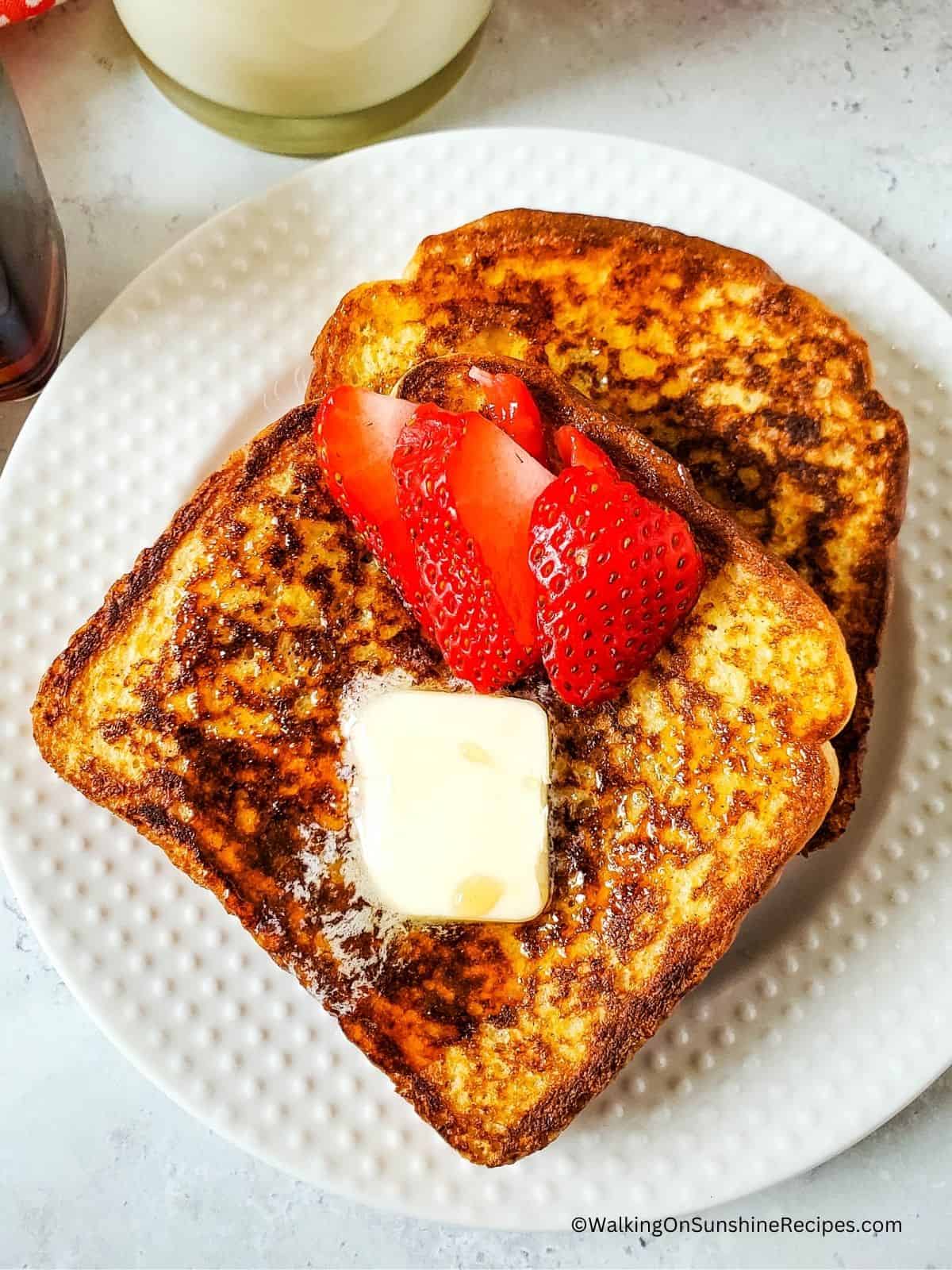 Closeup of French Toast served with strawberries.