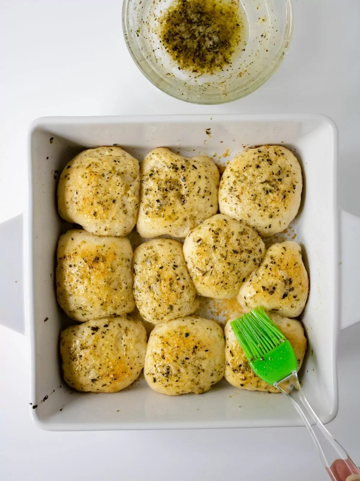 Baked biscuits brushed with melted garlic butter.