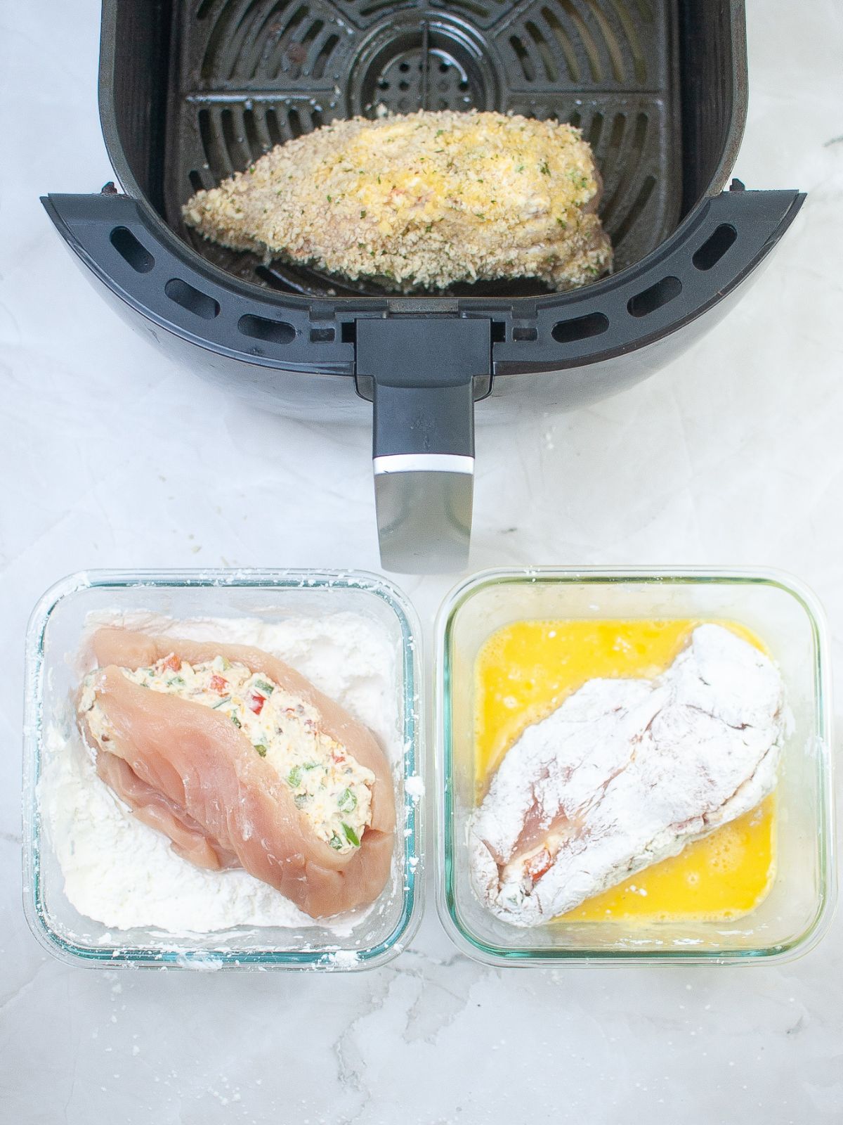 chicken breast in flour mixture, egg mixture and in air fryer.