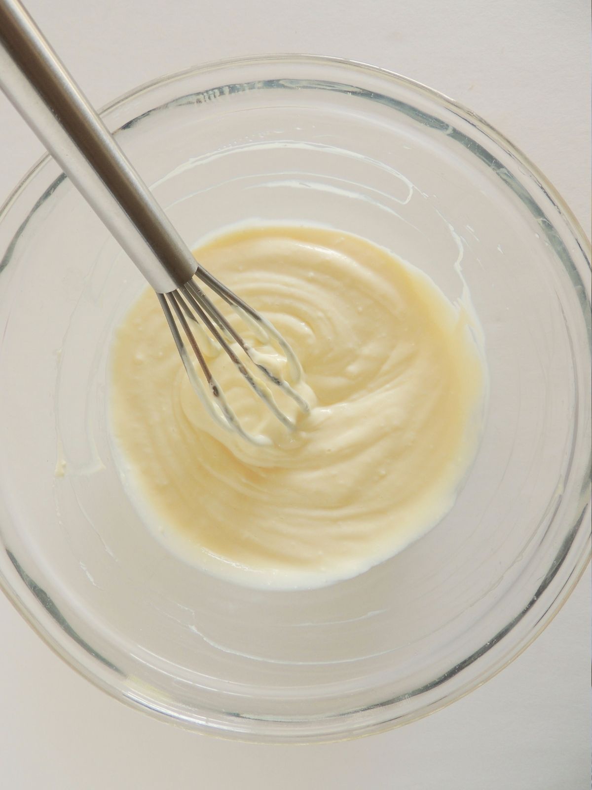 cream cheese frosting in glass bowl.