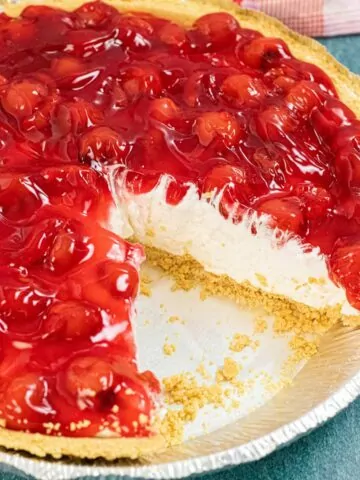 No Bake Cherry Cheesecake Pie with a slice taken out