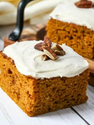 Homemade pumpkin spice cake with chopped pecans.