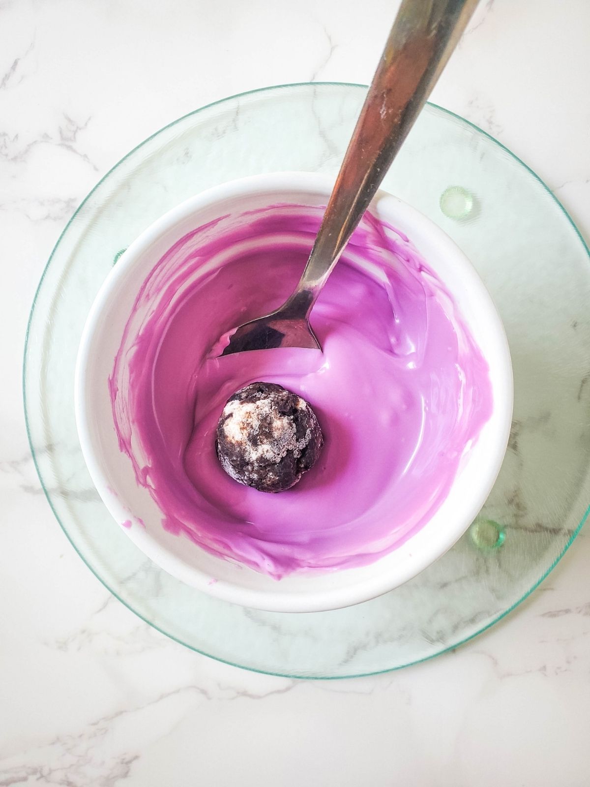 Melted purple candy with Oreo cookie ball.