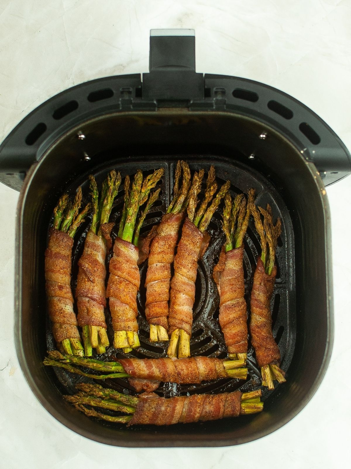 cooked asparagus with bacon in air fryer.