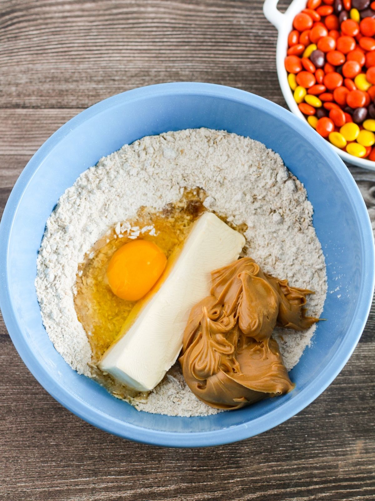 Egg, butter, flour mixture, peanut butter in mixing bowl.