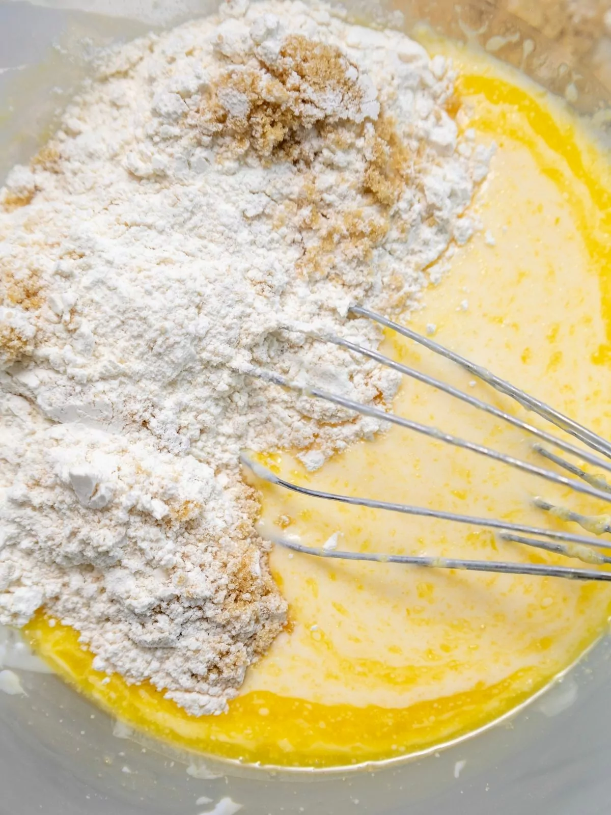 waffle batter in bowl with whisk.