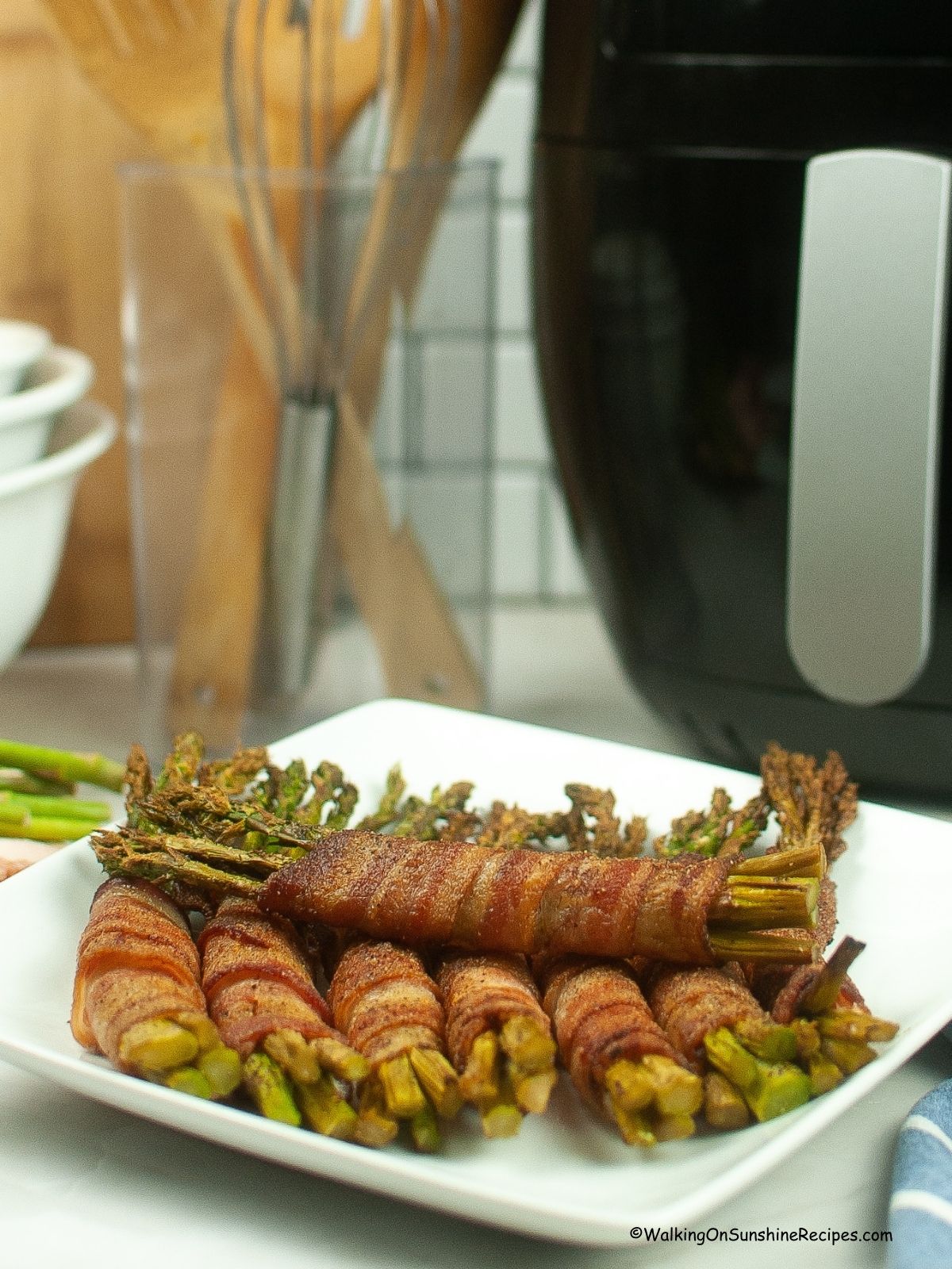 asparagus in bunches wrapped in bacon.