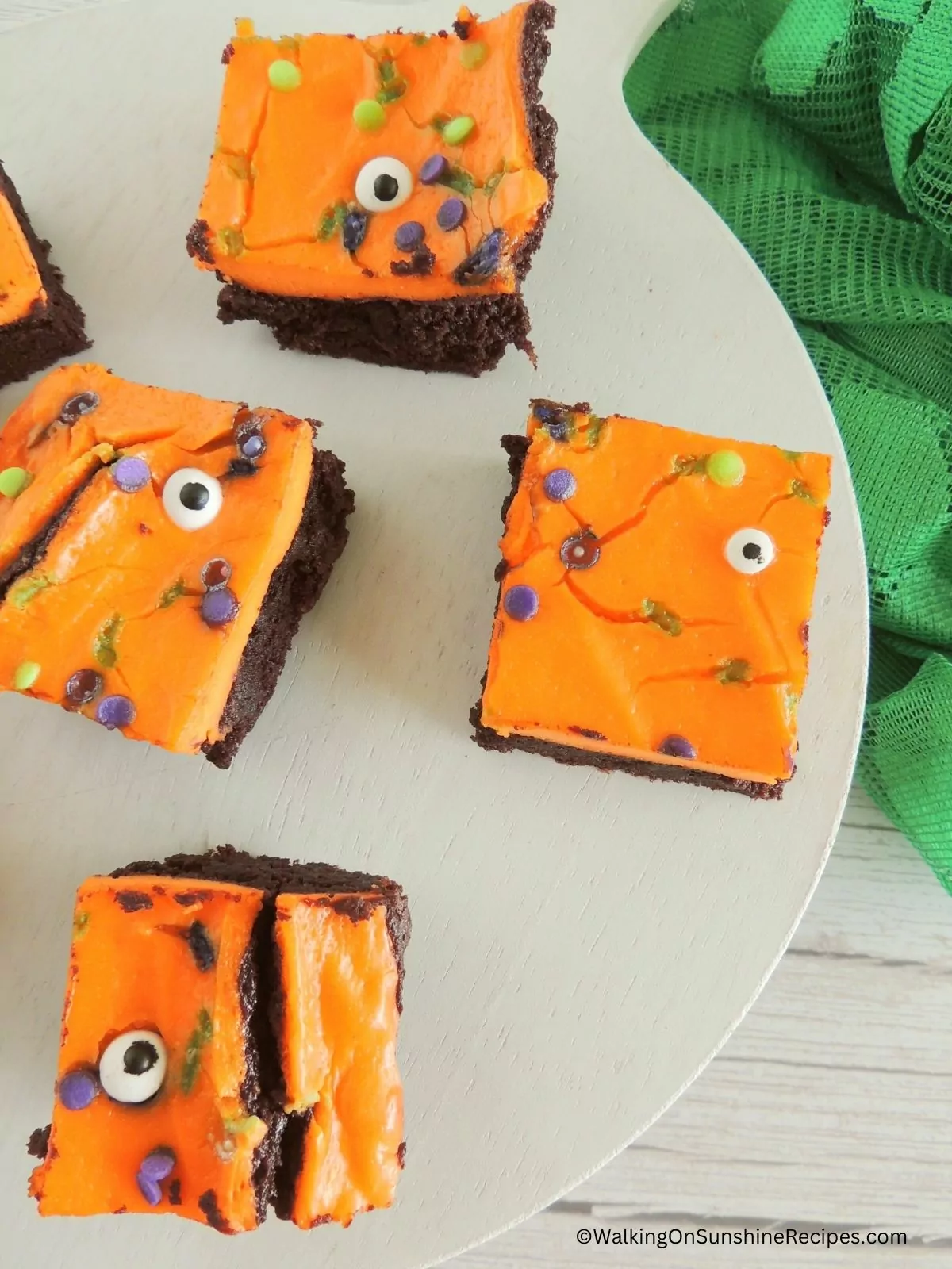 decorated brownies with orange frosting.