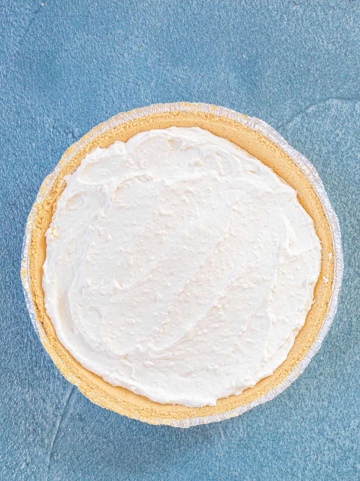 no bake cheesecake mixture in graham cracker crumb crust.