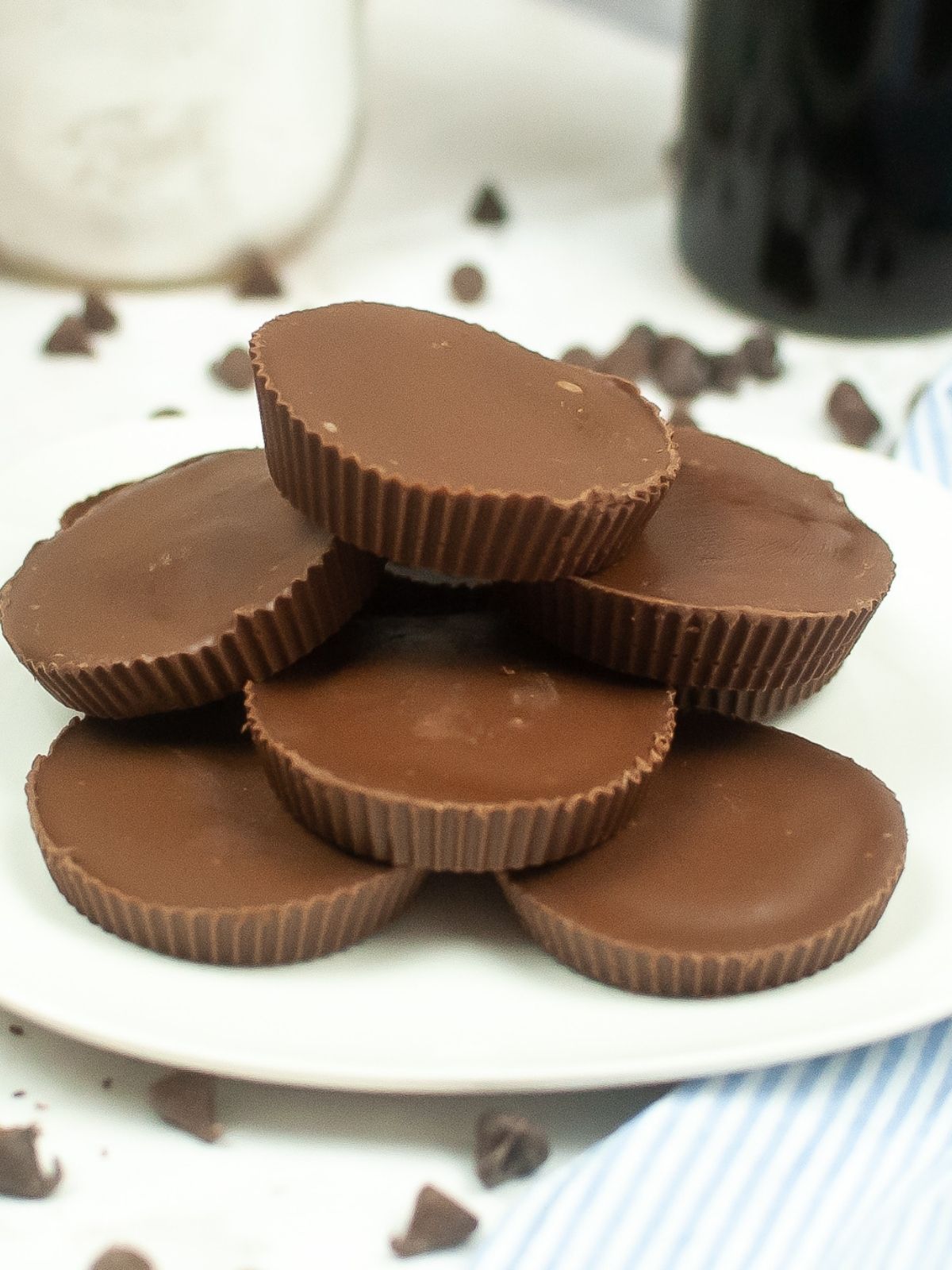 Reese's copycat peanut butter cups stacked on plate.