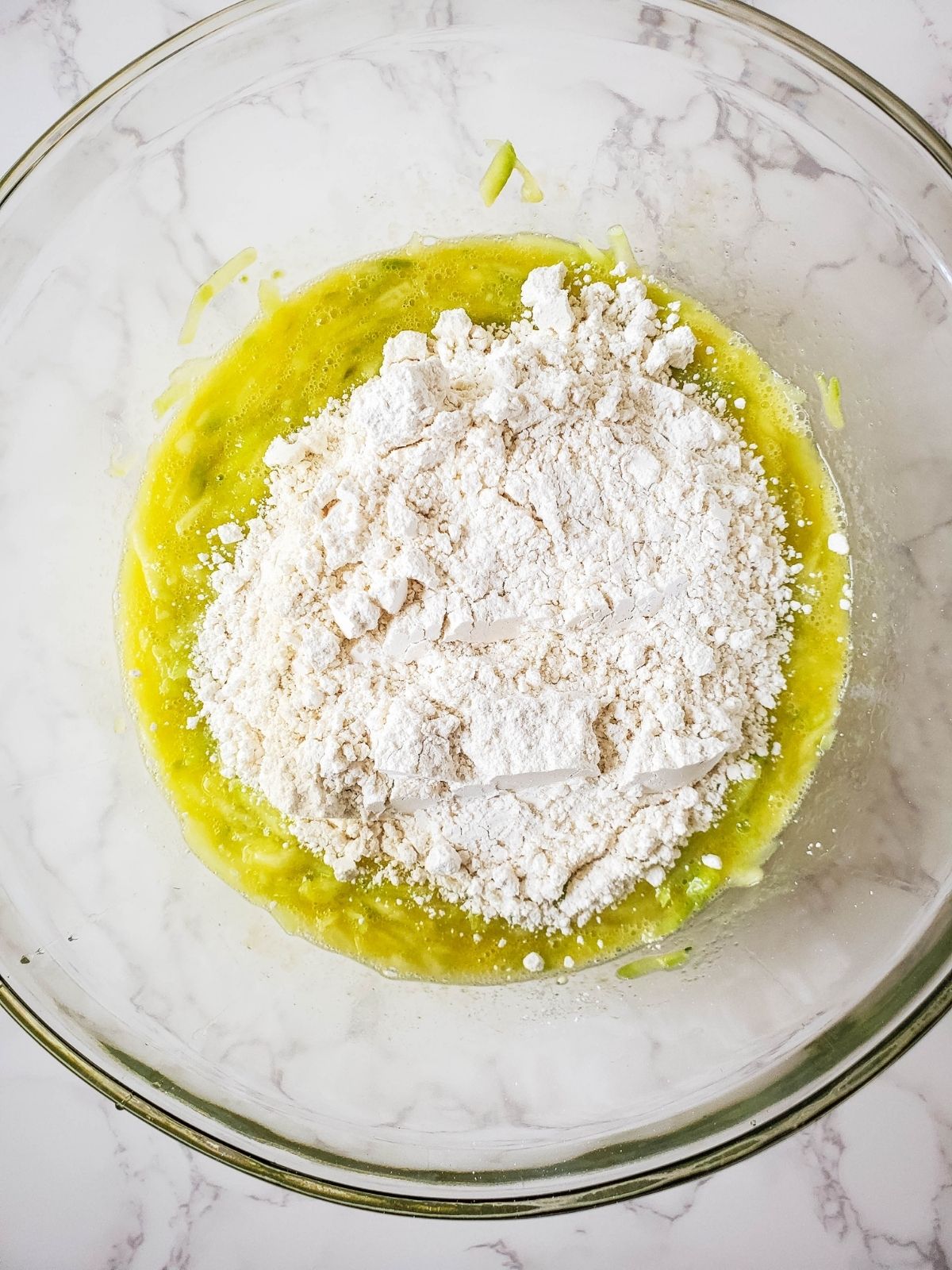 Add Bisquick mix to bowl with zucchini mixture.