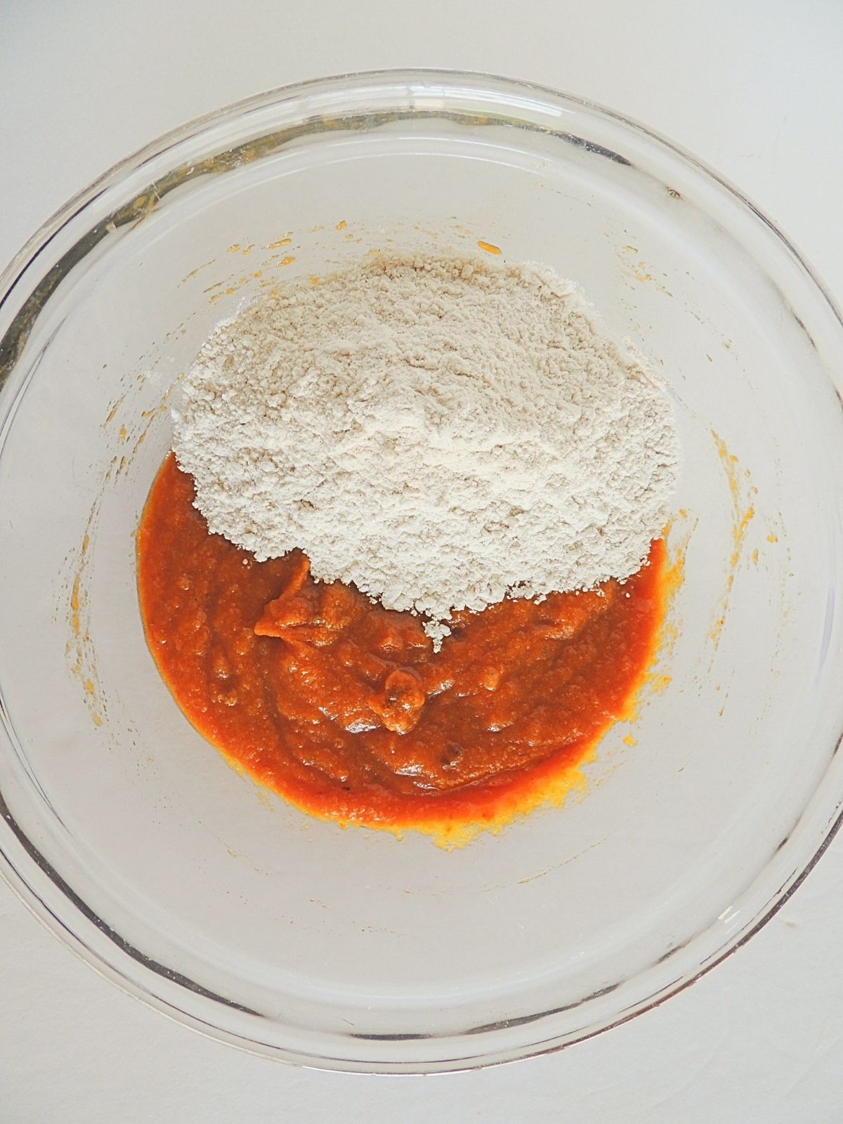 flour and pumpkin puree in bowl.