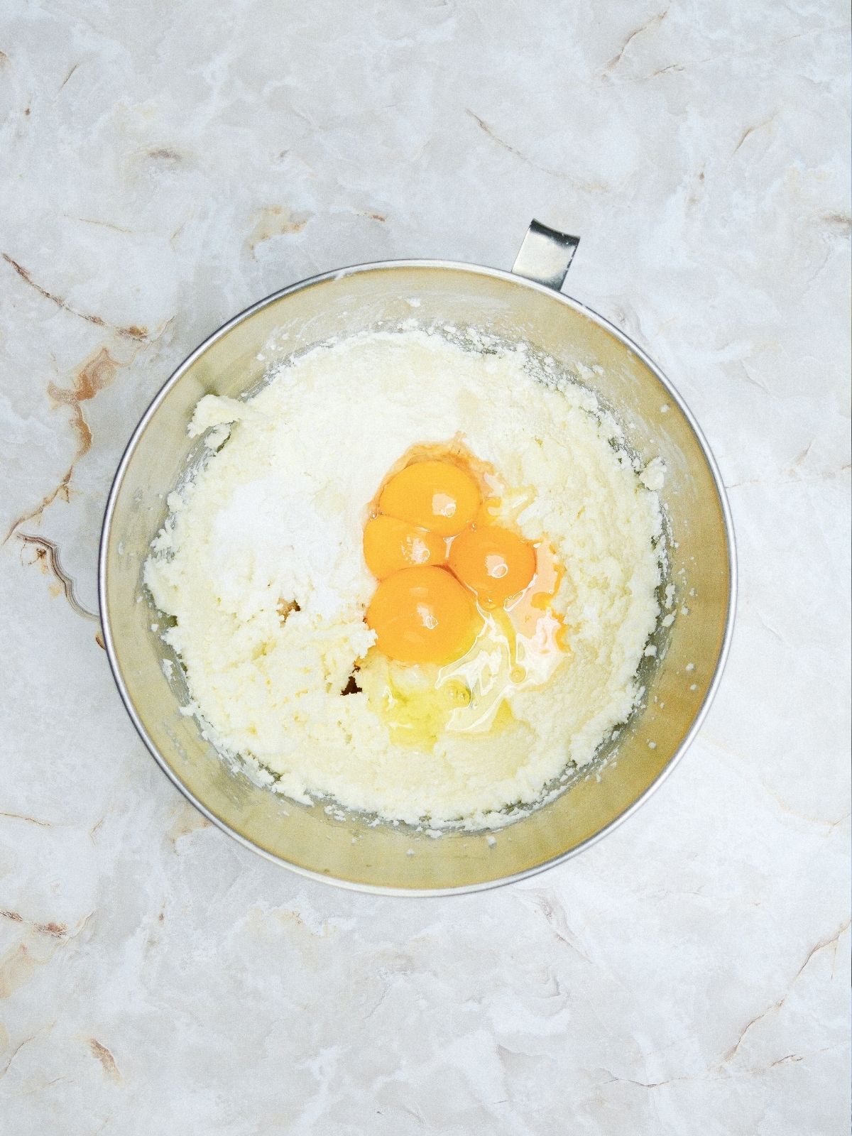 add eggs to butter sugar mixture in mixing bowl.
