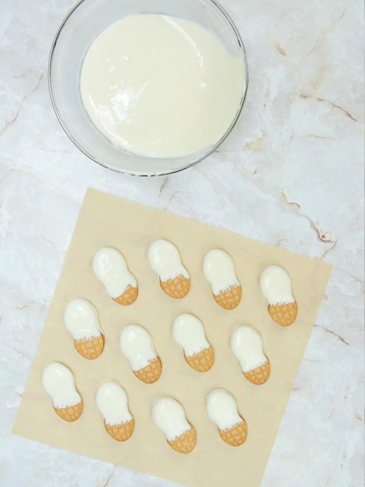 Dipped cookies in melted white chocolate.