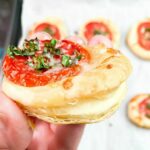 flaky layers of puff pastry with tomato appetizer.