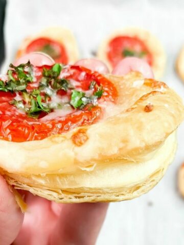 flaky layers of puff pastry with tomato appetizer.