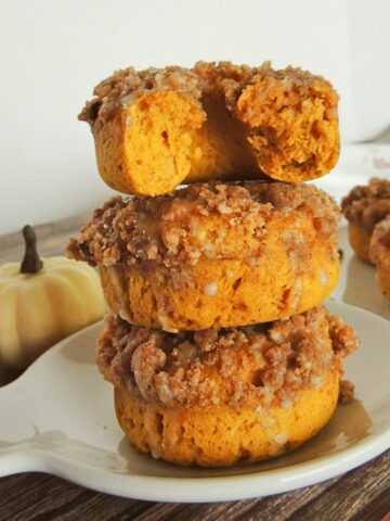stacked pumpkin donuts on plate featured photo.