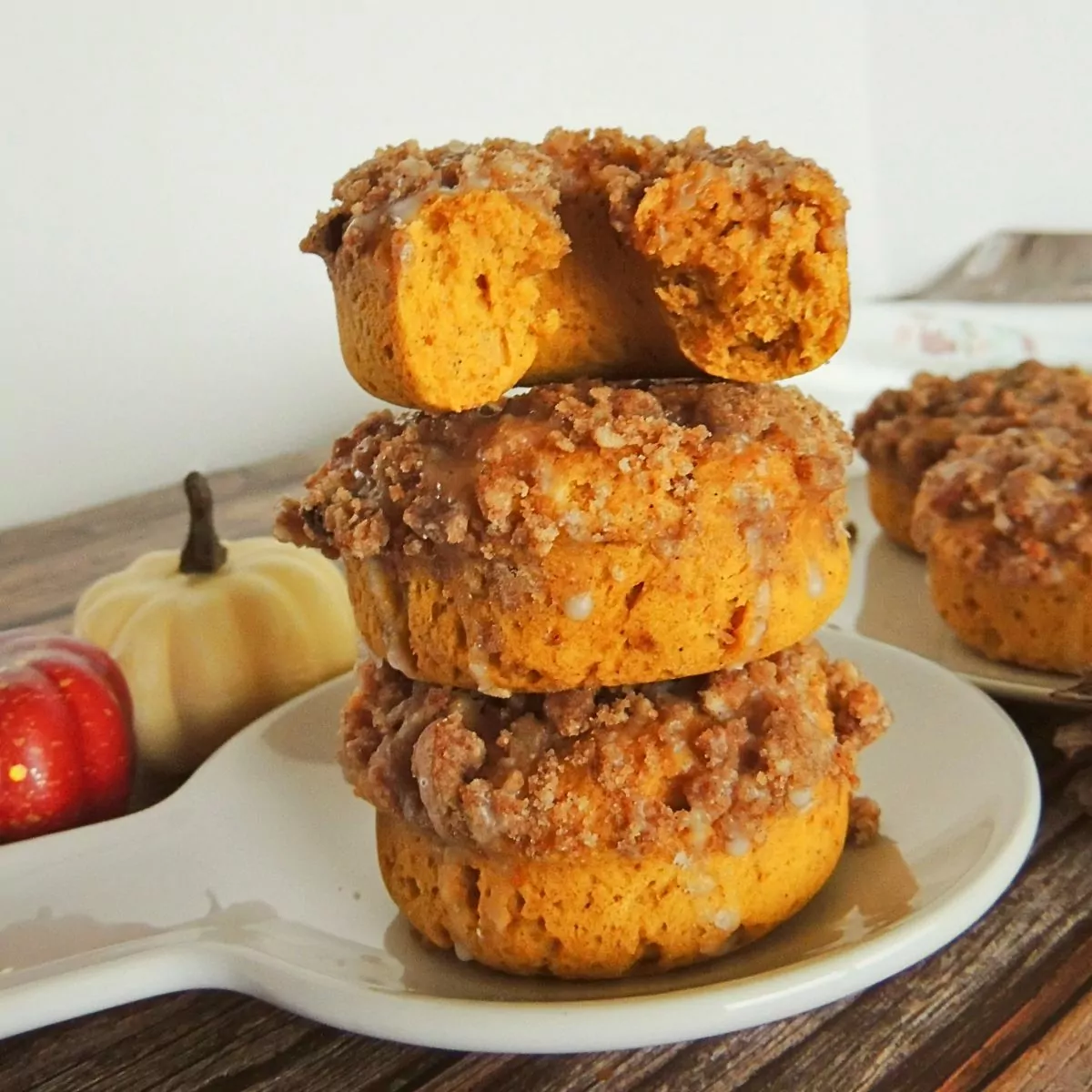 stacked pumpkin donuts on plate featured photo.