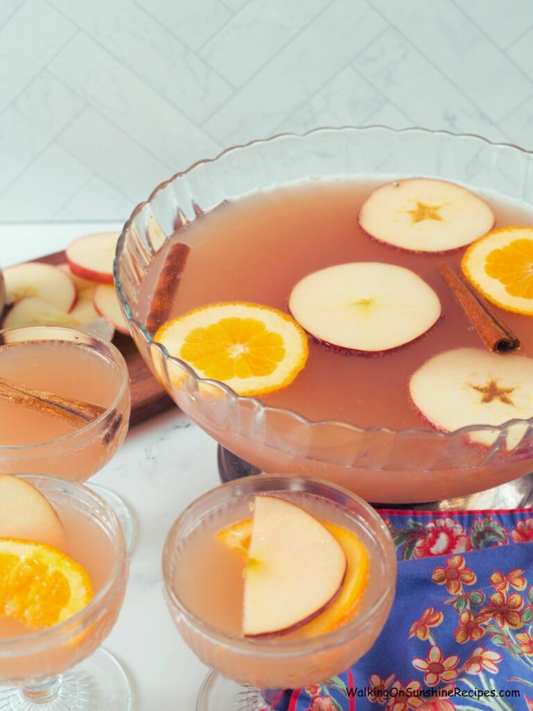 non-alcoholic Christmas drink in punch bowl with glasses filled.