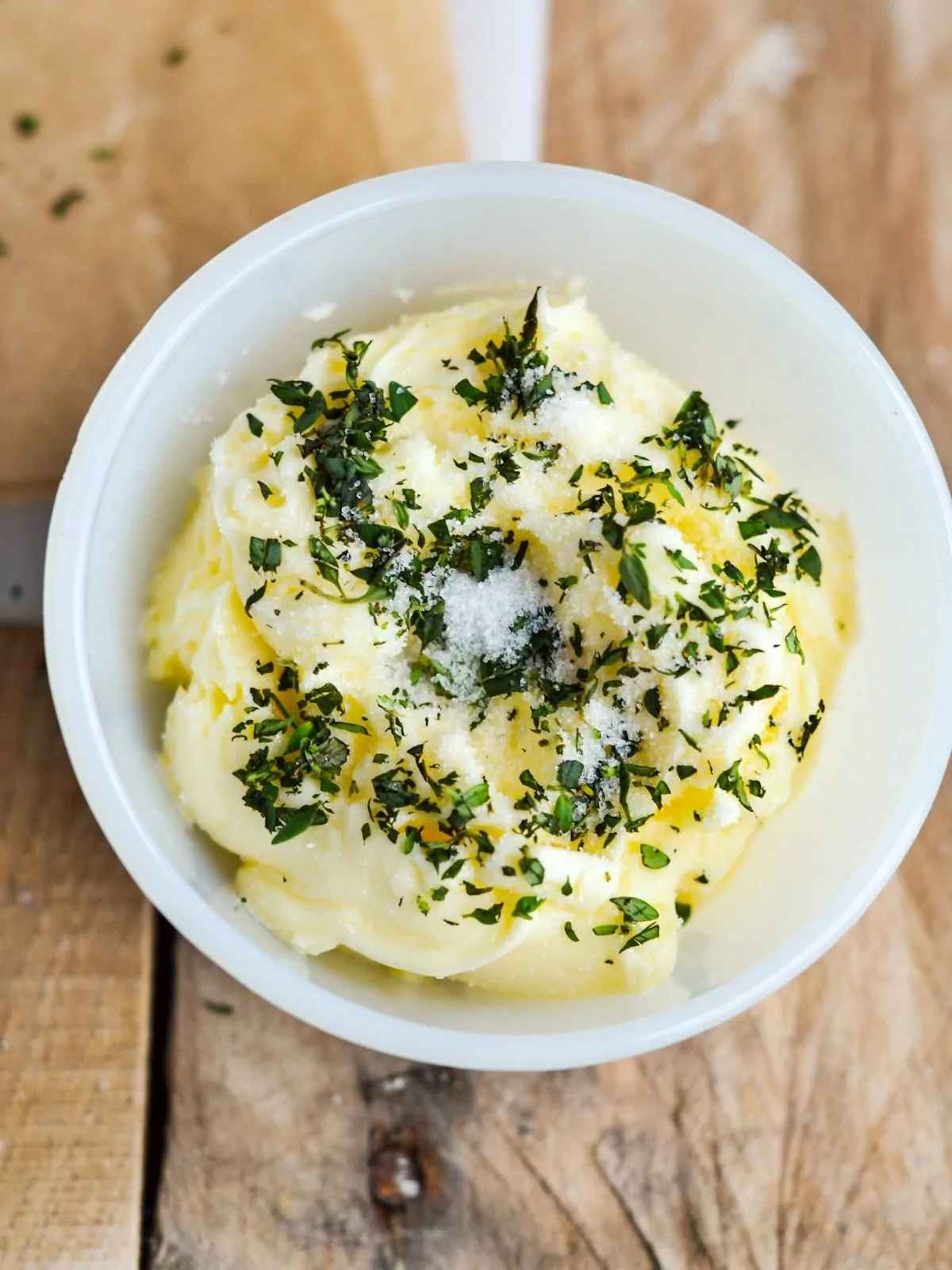 butter with herbs and salt in bowl.