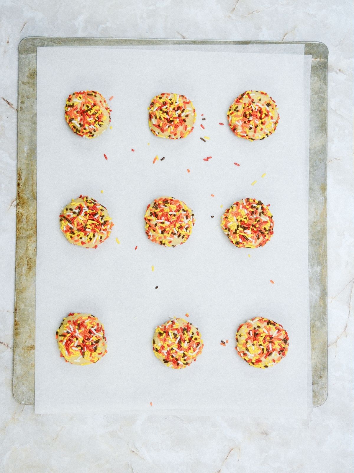 cookies before baking on cookie sheet pan with parchment paper.